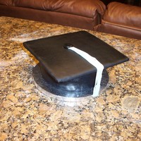 Graduation Cap For My Baby Girl Leaving Preschool Strawberry cake butter cream filling covered in satin ice black fondant and blue tasselfor my 5 year old daughter leaving preschool