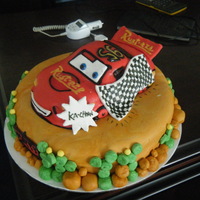 Lightning Mcqueen Melt I carved and stacked this cake while on vacation.... and while driving home on the five hour car ride, half the car melted. Literally...