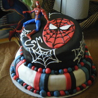 Spiderman For my nephew's 3rd bday. Chocolate chip cookie cake with caramel filing on bottom, swiss chocolate with cookies n' cream on top...
