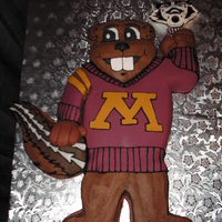 Minnesota Goldy Gopher Birthday Cake White and Chocolate cake with Buttercream and fondant. WI Badger made of a fondant gumpast mixture.