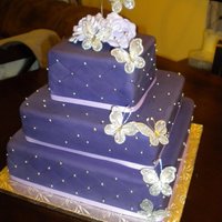 Purple Butterfly Cake The bride wanted a deep purple and butterflies. I was a little worried about if it would all work together, but she loved it.