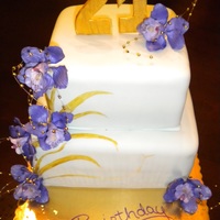 Natural Birthday Cake Made for a coworker, with purple flowers, gold accents, and a baby green fondant