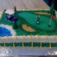 Golf Theme Retirement Cake Half Sheet cake with golf theme. Butter cream with a fondant golf green, sand traps and water.