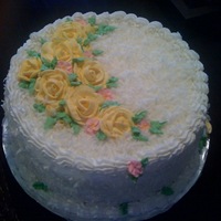 Birthday Cake White cake soaked with Malibu Coconut rum, filled with fresh pineapple filling and iced with buttercreme, covered with coconut.