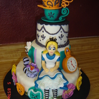 Oh, Alice!! Alice sits among some of the characters of wonderland. Which include: the talking pansies, the white rabbit and the cheshire cat. And of...