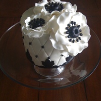 Anemone Flowers A cake I made for a get together. Cake is 6 inch vanilla with oreo cheese cake and ganache filling between each layer.