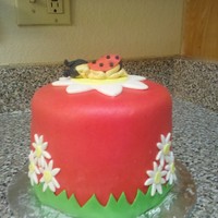 Baby Ladybug Cake a baby ladybug sleeping on a flower blanket!