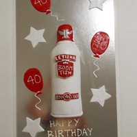 Smirnoff Vodka Bottle Cake Chocolate mud cake with white choc ganache. Fondant tinted light grey with silver lustre over top. Logo's personalised to suit the...