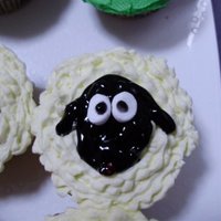 Cupcake Sheep Piped BC frosting to look like wool with black gel to make the face. Mini marshmellows for the eyes.