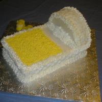 Baby Bed And Shoes Pound Cake (orange) with Orange buttercream - this cake must weight 20 pounds.