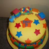 Train Baby Shower Cake Two 12" rounds and two 10" rounds. Covered in Homeade MMF, royal icing and fondant accents. Train made of mixture of fondant and...