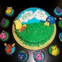Backyardigans Birthday Cake And Cupcakes For my daughters 3rd Birthday!! First time doing the color flow technique.Covered in buttercream. Clouds and flowers are fondant.