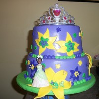 Princess And The Frog Birthday Cake Princess and the frog cake for a 3 year old birthday. MMF over buttercream. Fondant and Royal Icing accents. Plastic crown, pricess, and...