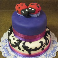 Happy Birthday Morgan! Two tiered red velvet cake covered in buttercream and fondant. The ladybugs are not edible made from molding clay. This cake marks my 2...