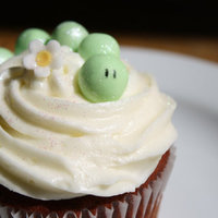 Caterpillar Cupcake Caterpillar is made of balls of sugarpaste rolled in shimmer dust. Cake is red velet with cream cheese frosting.