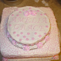 1St Tier Cake This is a cake I made for my niece's baptism. The top cake is an allergy free eggless chocolate, which is why you can see the overlap...