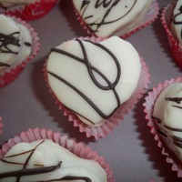 Strawberries And Cream Strawberries and cream pound cake dipped in white chocolate YUM! Also has fresh strawberries sliced in the middle.