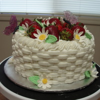 Strawberry Basket French vanila cake filled with white chocolate mouse and fresh strawberries. Buttercream icing, decorated with gumpaste flowers and gelatin...