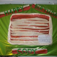 Tray Of Bacon Cake My little chunky son got this tray of raw bacon cake for his first birthday.