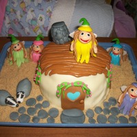 Fairy And Badger House Everything is edible. Brown sugar 'sand', fondant, and modeling chocolate details.