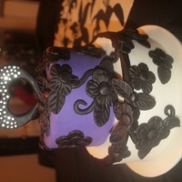 2Yr Anniversary Cake for 2 year Anniversary. Top Tier: 6" Round Caramel Chocolate Cake with a Caramel Buttercream cover in Satin Ice Purple Fondant....