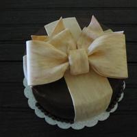 Chocolate Cake With Big Bow Chocolate butter-cream with fondant/gum paste bow. Inside is chocolate checkerboard.