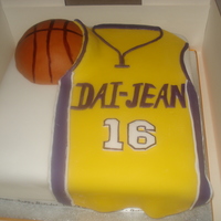 La Lakers Basketball Shirt Birthday cake for a 16 year old Lakers fan. Basketball is made from rice krispies squares covered with fondant. TFL!