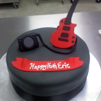 Guitar Themed Cake Chocolate cake covered in grey fondant (actually used Duff's new fondant because I was in a pinch and loved it!! It is buttercream...