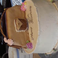 Purse Cake For B-Day This cake fell over while transporting it! Had to refrost and fix everything in an hour. Thanks for RI flowers to mend my fondant and extra...