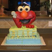 Elmo Cake Got the idea from Wilton web site. Elmo head and other decorations are made with melting discs, his hands modeling chocolate. The third...