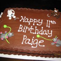 Cat Cake Simple sheet cake done for a young girl who loves cats. Gave me a chance to practice my fondant figures. It was fun!