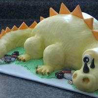 Yellow Dino Carved cake, with mmf. Idea copied from pic provided by birthday girl's mom (thanks to the creator!) rkt legs and tip of tail.