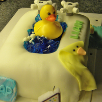 Bathtub This was my 1st fondant attempt- it was for my son's 1st birthday. Everything is fondant except the handles which are marshmallows,...