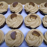 Peanut Butter Cup Cupcakes Chocolate cupcakes with Peanut Butter frostingand topped with 1/2 a Reese's cup