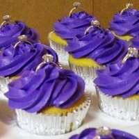 Purple Bridal Shower Cupcakes Vanilla cake with purple buttercream. Topped with diamond ring accents.