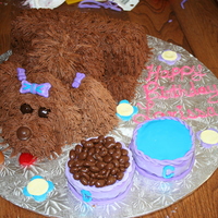 8 Yr Olds Birthday Puppy Cake I used the puppy tutorial on CC and it was really easy to make. A lot of fun too. The dog bowls are cake as well and fondant covered.