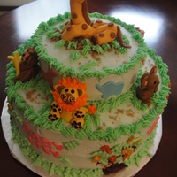 Zoo Animals This was a 2 layer, 10" cake with a 6" layer on top. It was a chocolate cake with Chambord and Raspberry filling and decorated...