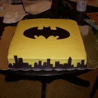 Batman This was a carrot cake with the crusting cream cheese icing. The accents are fondant. I feel like I'm getting better at this :)