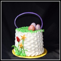 Easter Basket White chocolate cake with strawberry filling and white chocolate buttercream. The flowers, eggs, and handle are fondant/gumpaste. I didn&#...