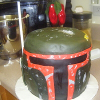 Star War's Boba Fett Helmet Cake 3D This was a groom's cake order! It was fun, but a lot of work! The cake is lemon with blueberry cream cheese frosting. The whole thing...