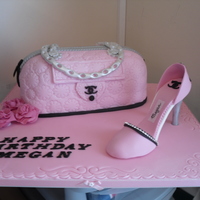 Meggies Cake Vanilla sponge with buttercream and white chocolate ganache. Had a nightmare with the black handles which collapsed just before delivery....