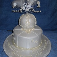Pearl Wedding Anniversary Cake Vanilla sponge, with chocolate ganache and fondant. The topper is a styrene ball covered in fondant, all the pearls are edible. The client...