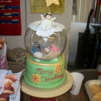 Snow Globe Snow globe with the manger scene in it. all edible except for the glass bowl. I put a sifter under the fondant top with powdered sugar in...