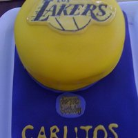 Los Angeles Lakers Airbrushed fondant cake made for a birthday celebration. I traced the logo on wax paper. Placed the wax paper on fondant and impressioned...
