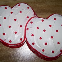 Valentine Cake I used two 10" round cakes cut into heart shapes. Twizlers and red candy hearts.