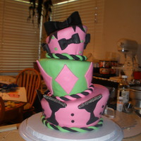 Topsy Turvy This was my first topsy turvy cake and the first time making bows. I don't know if you can see it really well in the picture, but...