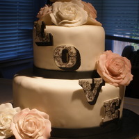 A 38Th Anniversary Cake Although it could easily also be a wedding cake. This was my first time making roses. And the letters are hand-cut and hand-painted. I...