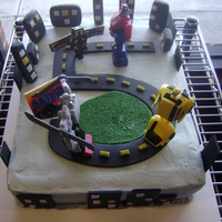Transformers This was a cake for a 5th birthday. He wanted Transformers and some of them battling. I had a different idea for the cake, but this is what...
