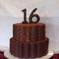 Sweet 16 Devil's Food cake with chocolate pastry cream filling; chocolate buttercream frosting, chocolate candy clay shaped in flower formers...