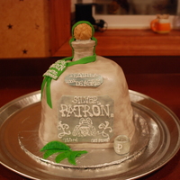 Patron Silver - Tequila! Carved out of cake and covered in fondatnt. Label writing was all done by free hand and the neck of the bottle and cork were all cereal...